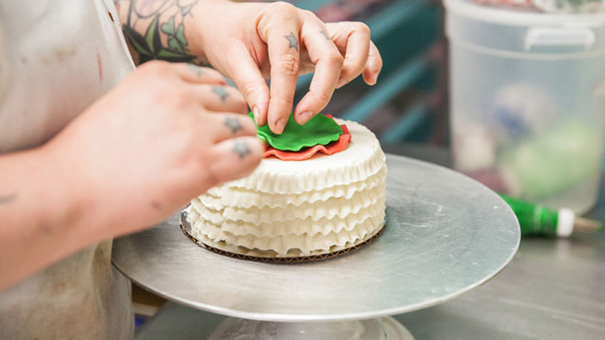 Aspen decorating a cake